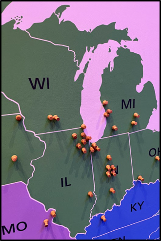 Map showing Michigan, Wisconsin, Indiana and Illinois, with pins in it.