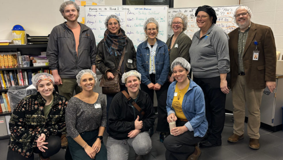 Group shot of the Partridge Creek Farm project team visiting Muskegon Career Technical Education School where the team learned about working with students to process potatoes and other local foods and integrate them into school meals.